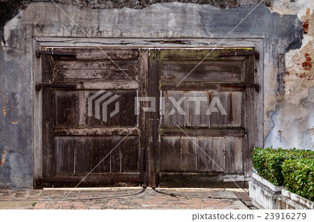 Old wooden door on the wall Old wooden door on the wall 23916279
