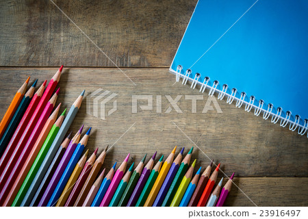 Colored pencils on a wooden 23916497
