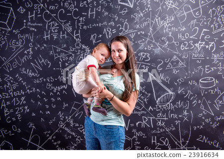 Young mother with little daughter against big Young mother with little daughter against big 23916634