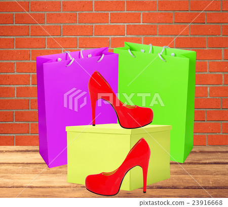 Red woman shoe, yellow gift box and shopping bags 23916668