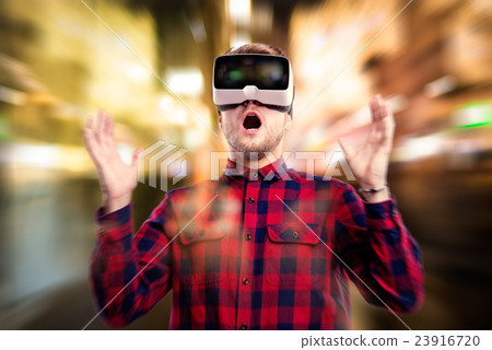 Double exposure. Man wearing virtual reality 23916720