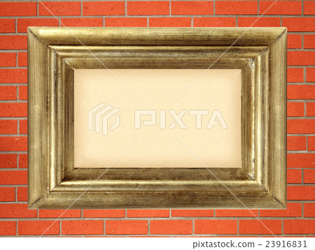 empty golden wooden frame on the red brick wall 23916831