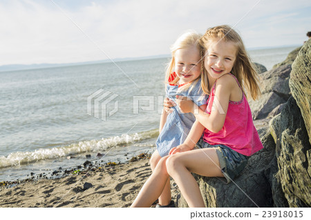 sisters at the beach on sunset 23918015