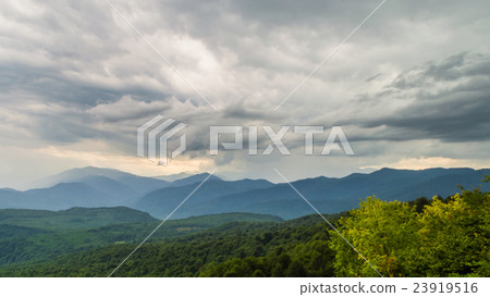 Sunset before the storm in mountains 23919516