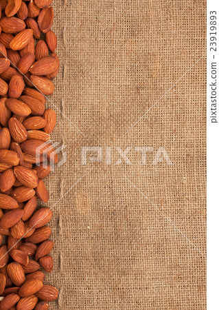 Almond lying on burlap Almond lying on burlap 23919893