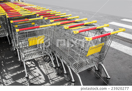 Shopping carts on a parking lot, close up photo 23920277