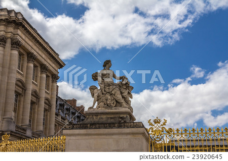 Statue at the gate of Versailles palace in Paris 23920645