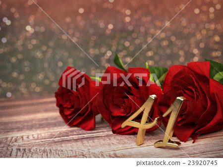 birthday concept with red roses on wooden desk 23920745