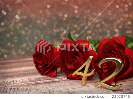 birthday concept with red roses on wooden desk 23920746