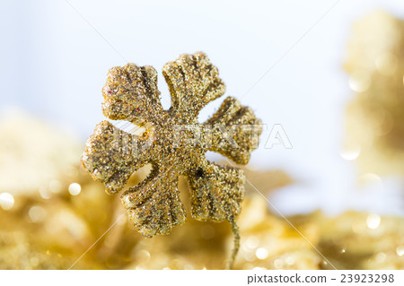 gold snowflake with golden bokeh 23923298