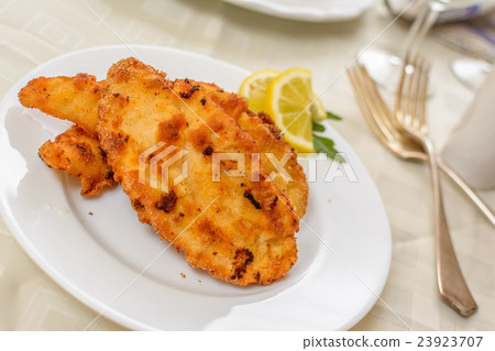 Wiener schnitzel with potato salad Wiener schnitzel with potato salad 23923707