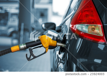 Car refueling on a petrol station Car refueling on a petrol station 23924003