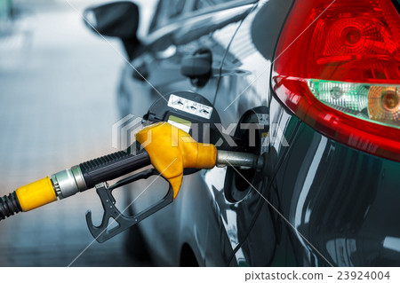 Car refueling on a petrol station Car refueling on a petrol station 23924004