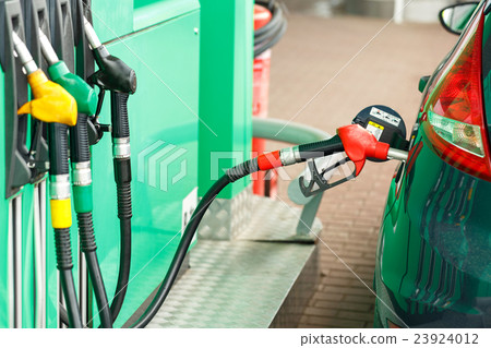 Car refueling on a petrol station Car refueling on a petrol station 23924012