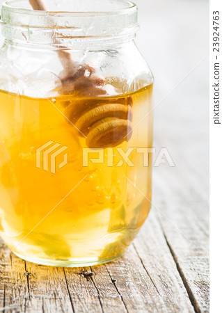 Wooden honey stick. 23924763