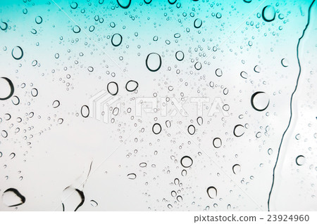Water drops background. Water drops on glass window over blue sky 23924960