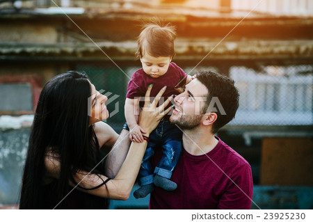 young family with a child on the nature 23925230