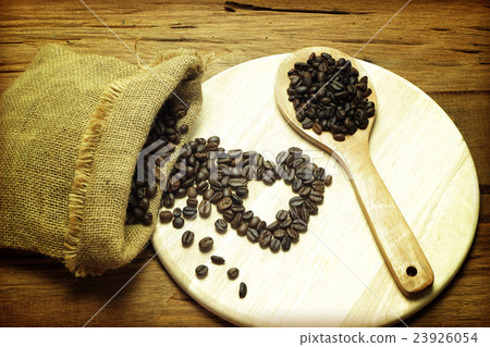 heart from coffee beans on old wood 23926054