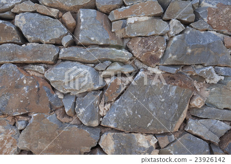 Wall from large stone textured basalt. Wall from large stone textured basalt. 23926142