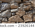 Wall from large stone textured basalt. 23926144