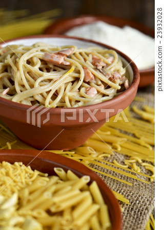 uncooked pasta and spaghetti alla carbonara uncooked pasta and spaghetti alla carbonara 23932028