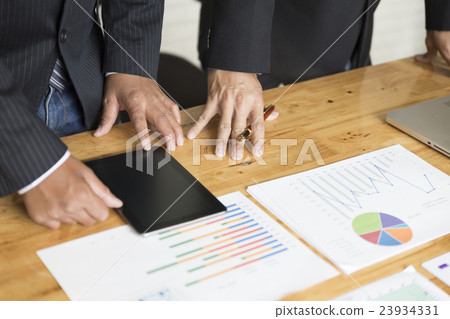 businessman analyzing with tablet and paperwork d businessman analyzing with tablet and paperwork d 23934331