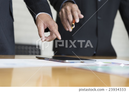 businessman analyzing with tablet and paperwork d businessman analyzing with tablet and paperwork d 23934333