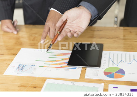 businessman analyzing with tablet and paperwork d businessman analyzing with tablet and paperwork d 23934335