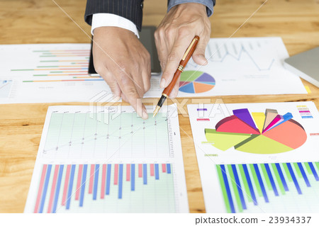 businessman analyzing with tablet and paperwork d businessman analyzing with tablet and paperwork d 23934337