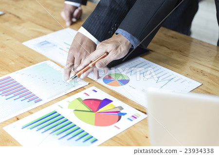 businessman analyzing with tablet and paperwork d businessman analyzing with tablet and paperwork d 23934338