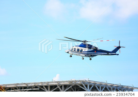 helicopter parking landing on offshore platform 23934704