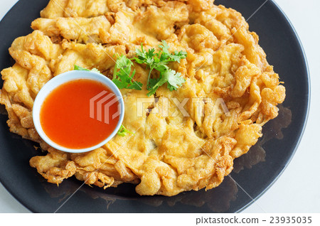 omelet and chili sauce in Thai style. 23935035