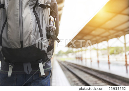 man with backpack at train station man with backpack at train station 23935362