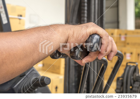 hand touching steering wheel control and Cabin for 23935679