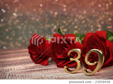 birthday concept with red roses on wooden desk birthday concept with red roses on wooden desk 23938436