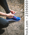 Running shoes. Closeup of woman tying shoe laces 23940089