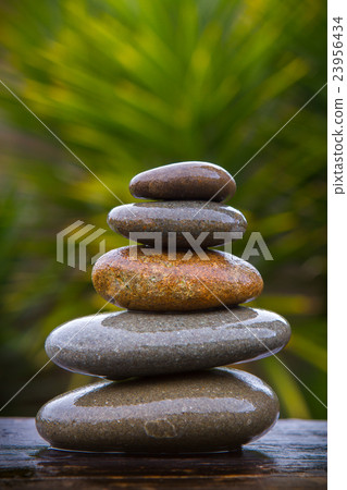 stack of round smooth wet pebbles stack of round smooth wet pebbles 23956434