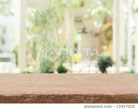 Stone board empty table blur in coffee shop. Stone board empty table blur in coffee shop. 23957028