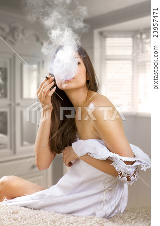 woman smokes a cigaret 23957471