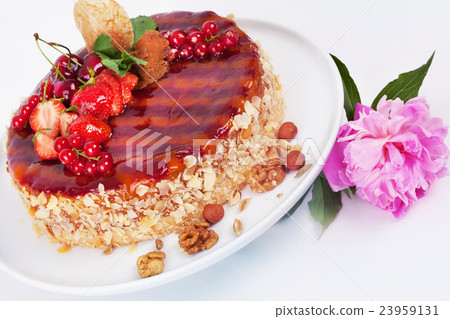 cake with strawberries currants cherries and nuts 23959131