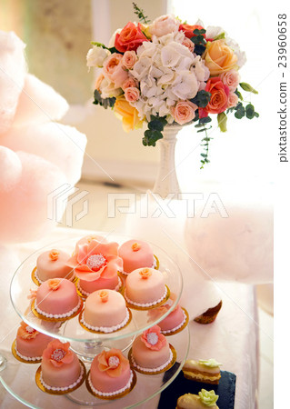pink cupcakes on a glass stand  23960658