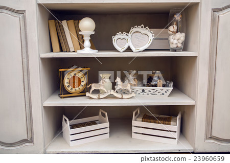 white outdoor small cupboard with trivia books 23960659