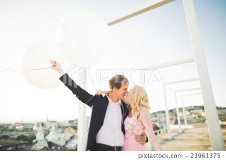 Pretty sunny outdoor portrait of young stylish 23961375