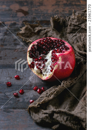 Sliced ripe pomegranate 23961770