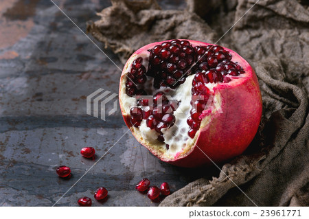 Sliced ripe pomegranate Sliced ripe pomegranate 23961771
