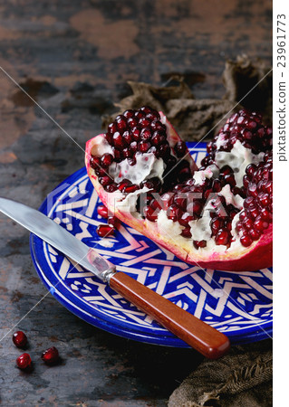 Sliced ripe pomegranate Sliced ripe pomegranate 23961773