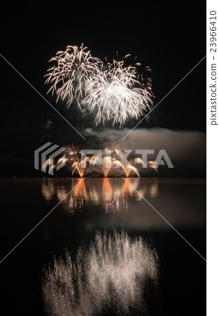 Colorful fireworks with reflection on lake. 23966410