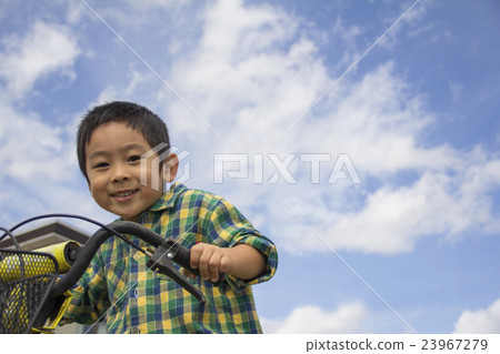 A boy riding a bicycle A boy riding a bicycle 23967279