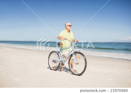 Smiling senior man with bike Smiling senior man with bike 23970980