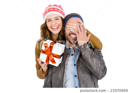 Woman giving a surprise gift to her man Woman giving a surprise gift to her man 23970989